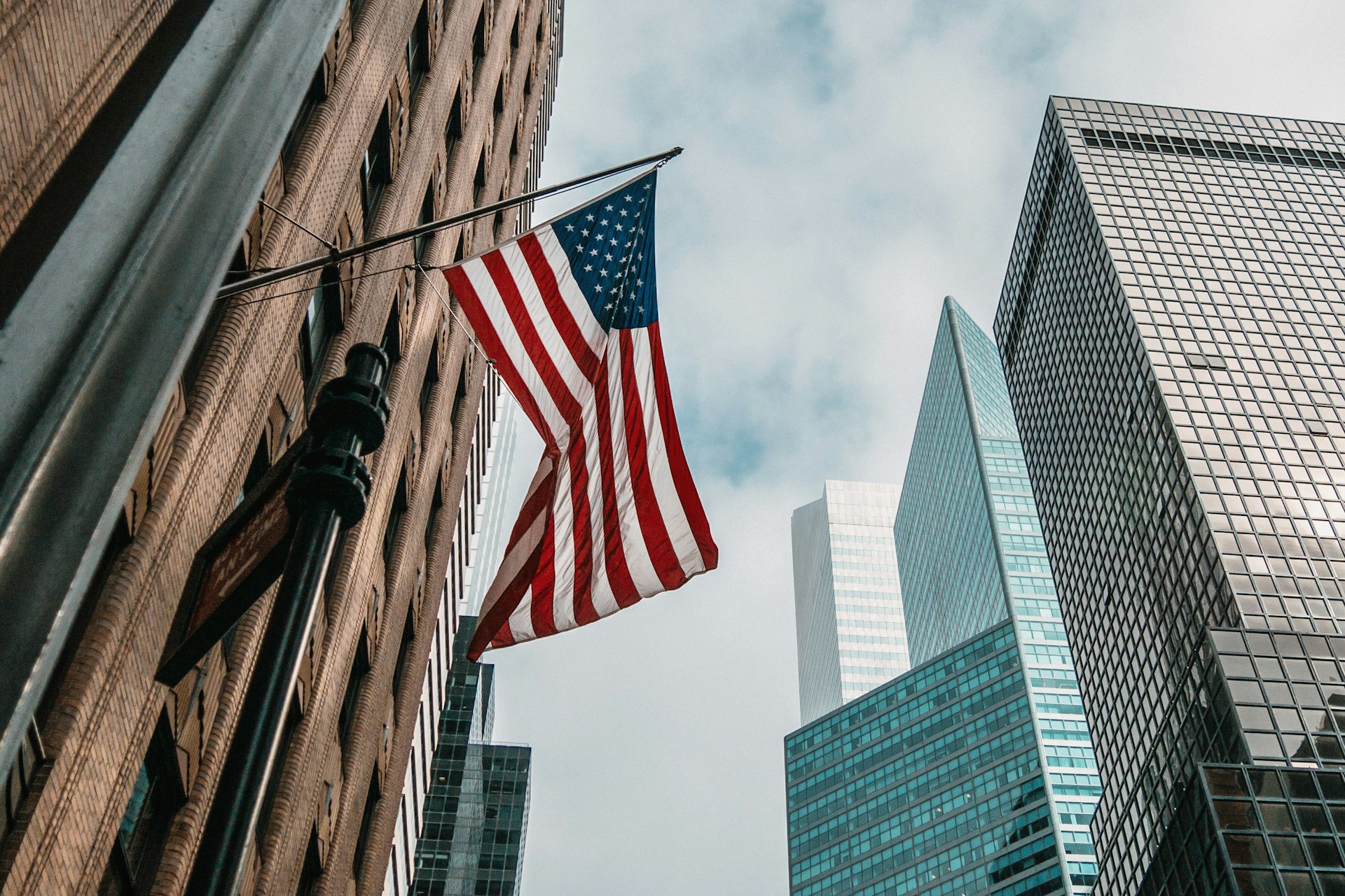 American flag on a New York City building, representing marriage-based green card immigration services
